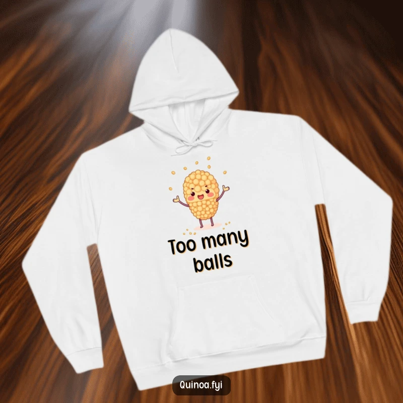 Funny hoodie with a quinoa cluster juggling tiny grains, soft and humorous apparel for cozy moments, ideal for a funny gift.